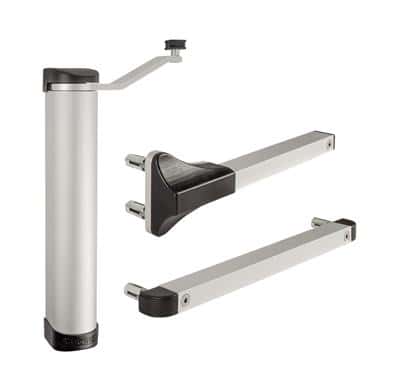 En dørlukker i metal, Portlukker fra Locinox, har et elegant, moderne design. Apparatet består af et cylindrisk legeme med en arm forbundet med et drejeled. Armen, vist i både udstrakt og foldet position, virker holdbar med glatte sorte accenter på stik.