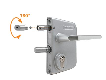 Her ses en sølvfarvet Locinox overflademonteret låsekasse komplet med håndtag. Et indsat diagram demonstrerer den reversible funktion ved at vise den cylindriske komponent, der roterer 180° før indsættelse.