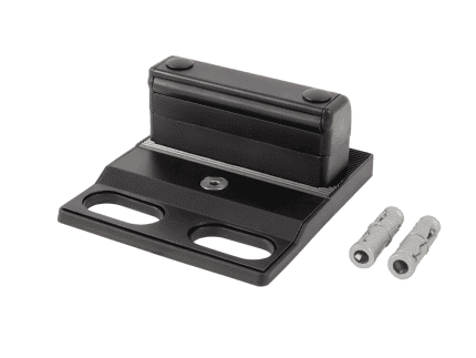 En Locinox bundstop til dobbeltlåger – justerbart og overflademonteret (RAL 9005) med en rektangulær top og monteringsbase, vist sammen med to grå vægdyvler på en hvid baggrund.